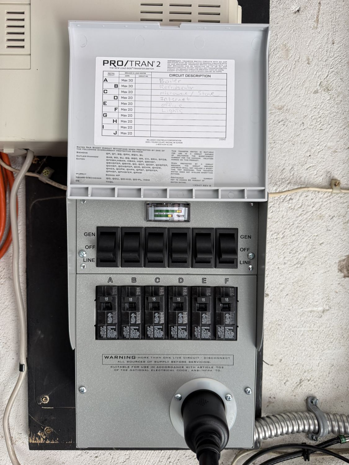 Open Reliance Pro/Tran 2 transfer switch showing six labeled backup circuits and a watts meter, Glen Rock, NJ