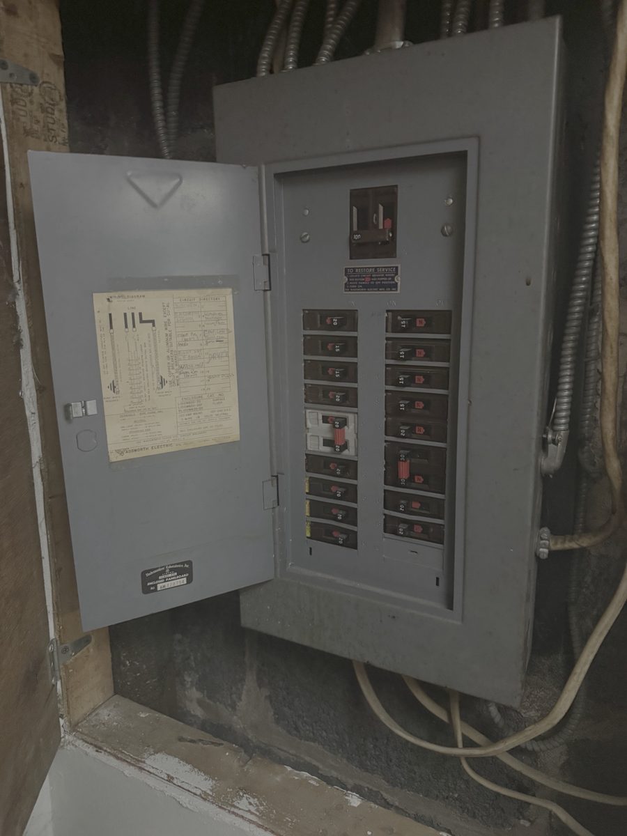 Before photo of an outdated Wadsworth electrical panel with tripped breakers and no spare capacity — a clear sign a panel upgrade is needed, later replaced by Fuse Electric LLC